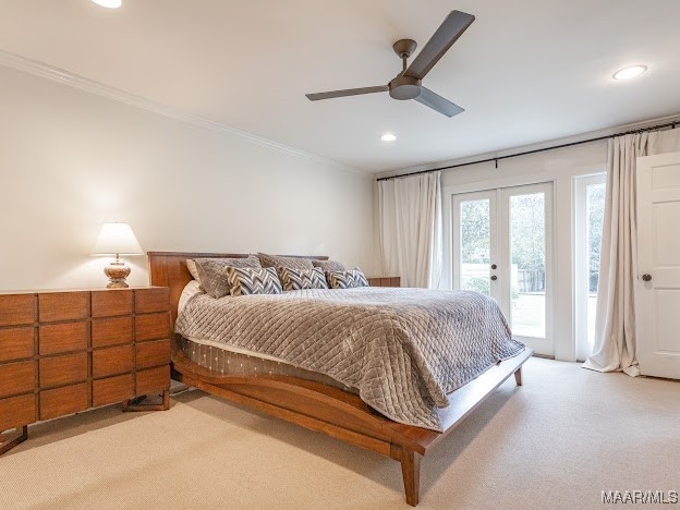 bedroom featuring light carpet, ceiling fan, access to exterior, and crown molding