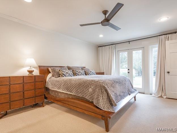 bedroom with light carpet, recessed lighting, access to outside, and french doors