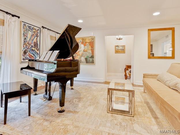 sitting room with recessed lighting, baseboards, and crown molding