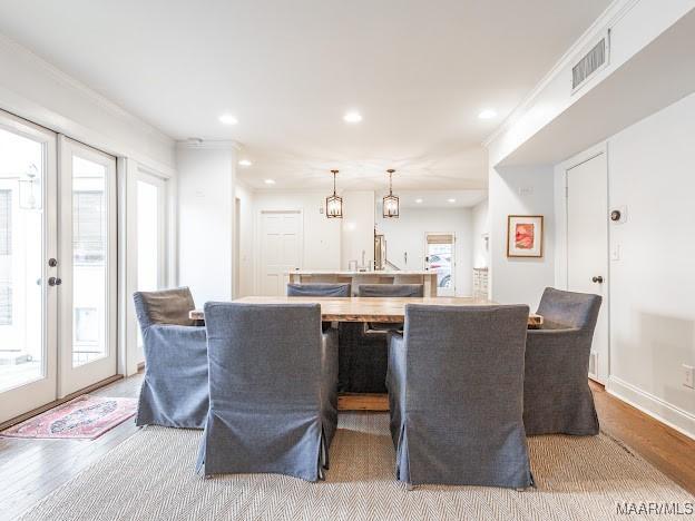 interior space with visible vents, recessed lighting, and wood finished floors