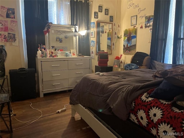 bedroom with dark wood-style floors