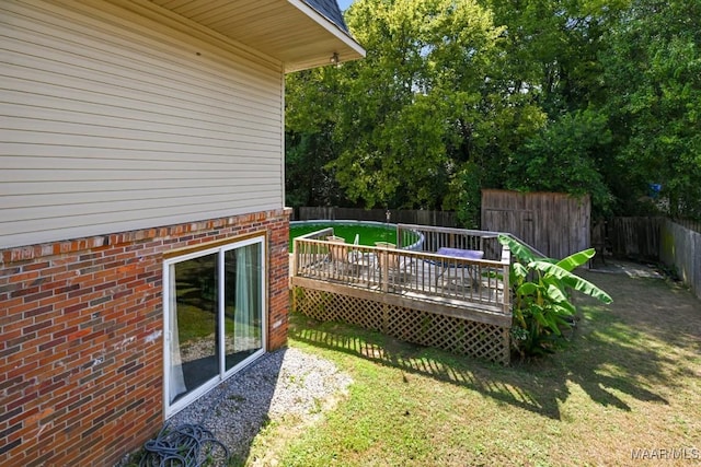 view of yard featuring a wooden deck