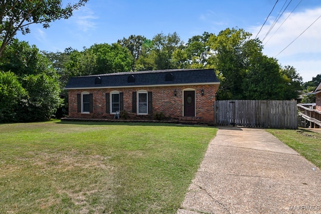 single story home with a front yard