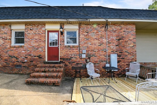 doorway to property featuring a wooden deck