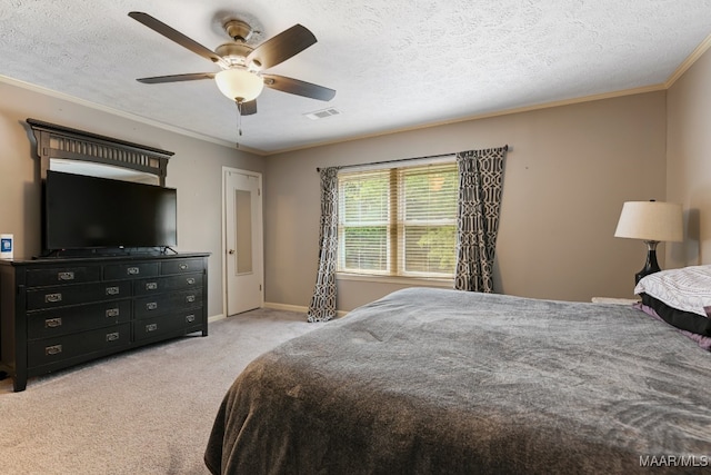 carpeted bedroom featuring a textured ceiling, ceiling fan, and crown molding