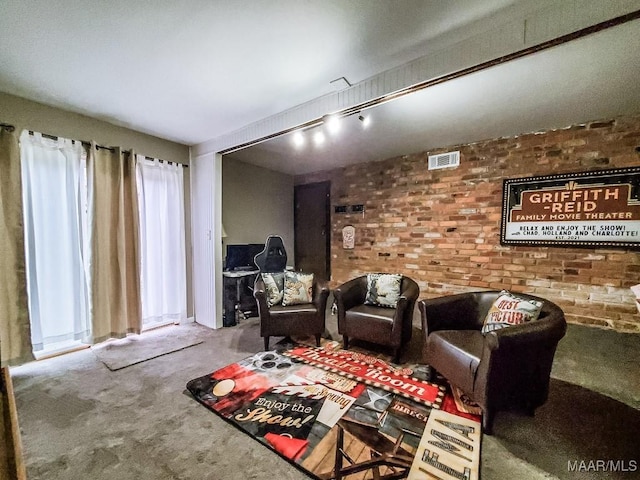 living room featuring carpet and brick wall