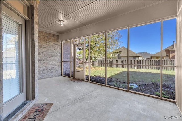 unfurnished sunroom featuring plenty of natural light