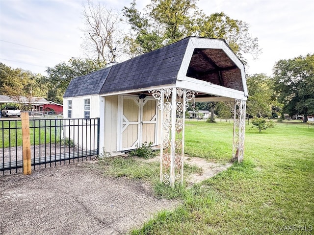 view of outdoor structure with a lawn