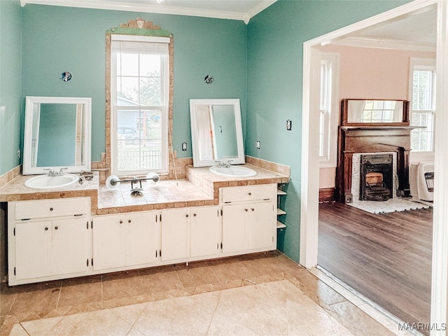 bathroom with vanity, hardwood / wood-style floors, and ornamental molding