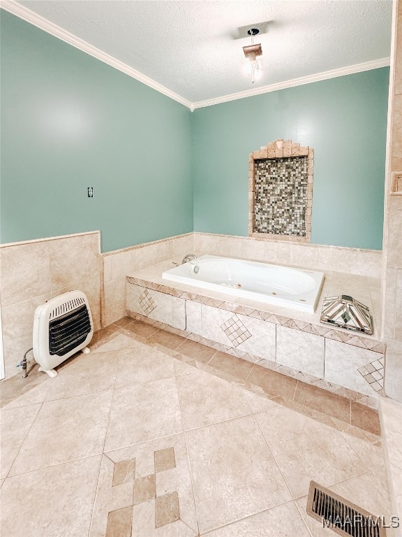 bathroom with heating unit, crown molding, a relaxing tiled tub, tile patterned flooring, and a textured ceiling