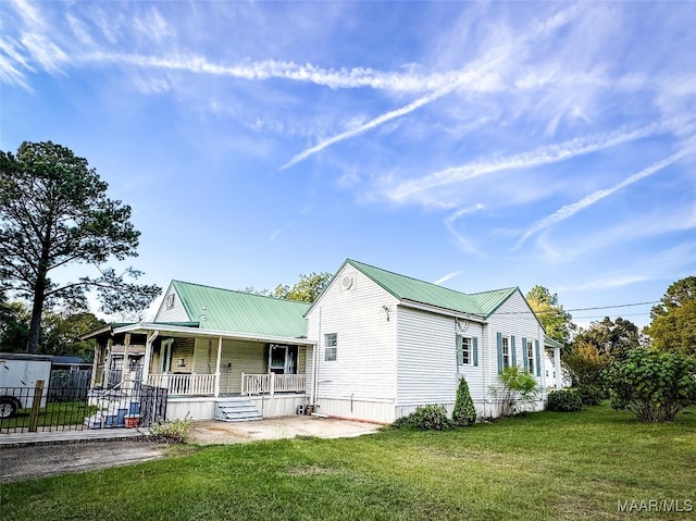 view of front of house with a front lawn and a porch