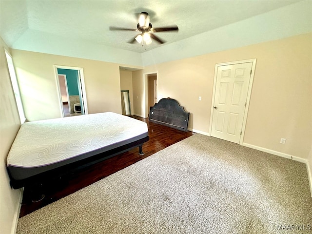 bedroom with ceiling fan and dark hardwood / wood-style floors