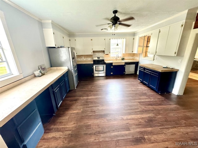 kitchen featuring stainless steel appliances, dark wood-type flooring, blue cabinets, and white cabinetry