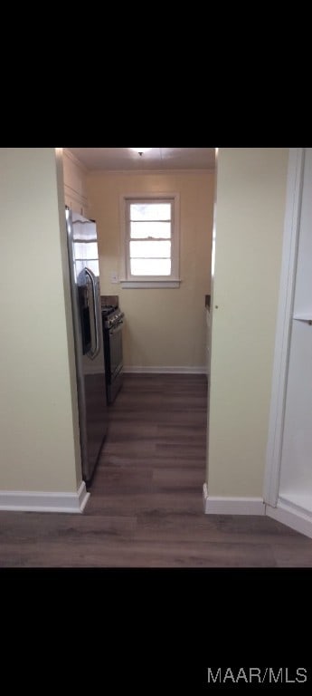 corridor featuring dark hardwood / wood-style flooring