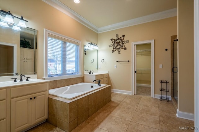 bathroom featuring plus walk in shower, vanity, tile patterned flooring, and crown molding