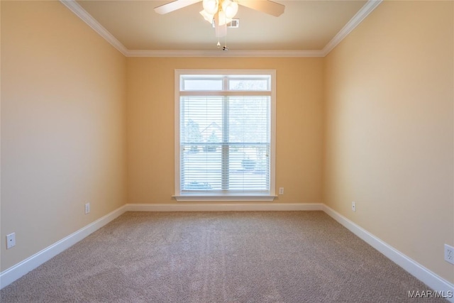 spare room with carpet floors, ceiling fan, and crown molding