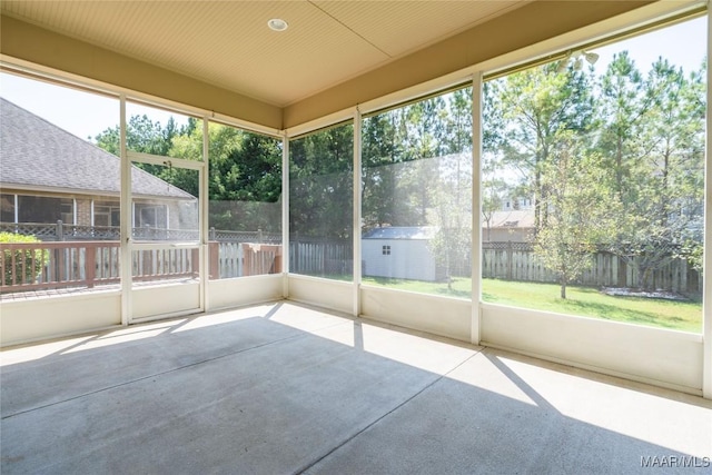 unfurnished sunroom with plenty of natural light