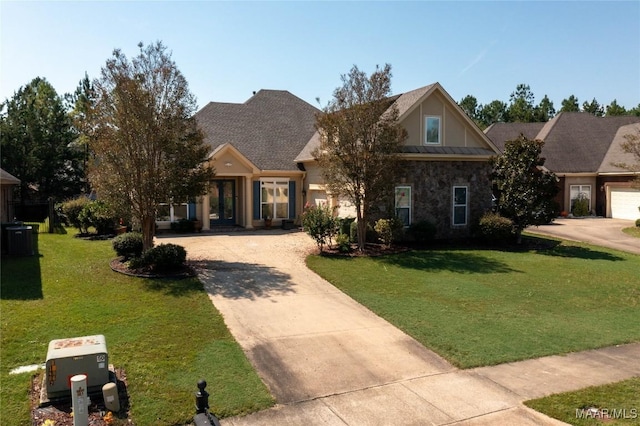 craftsman-style home with cooling unit and a front yard