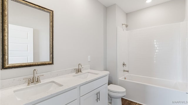 full bathroom with vanity,  shower combination, toilet, and wood-type flooring