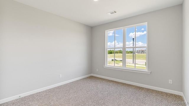 unfurnished room with carpet flooring