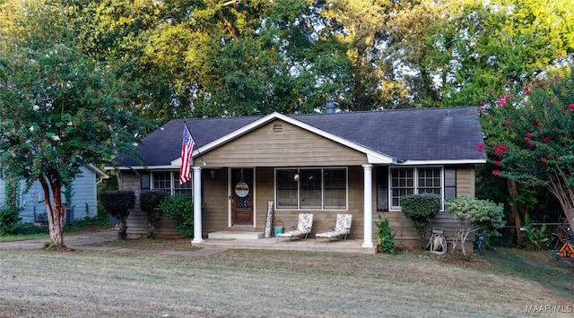 view of front of house with a front lawn and a porch