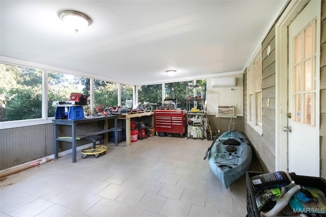 sunroom with a wall mounted air conditioner