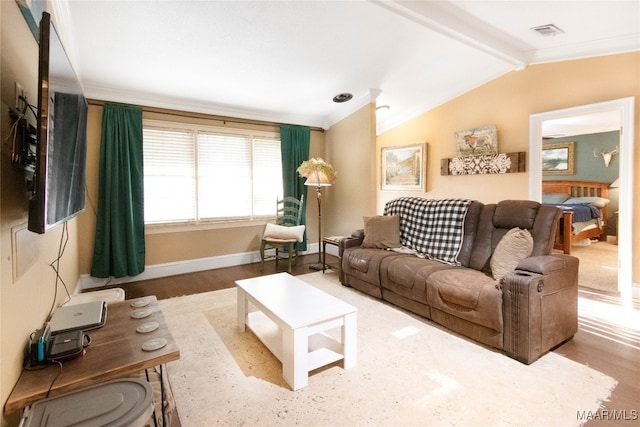 living room with lofted ceiling with beams, hardwood / wood-style flooring, and ornamental molding