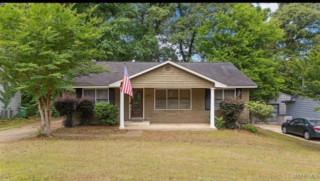 3033 Willow Lane Dr, Montgomery, AL 36109 - ranch-style house featuring a front yard, covered porch, and central AC unit