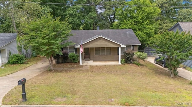 3033 Willow Lane Dr, Montgomery, AL 36109 - ranch-style home featuring a porch, a front yard, and cooling unit