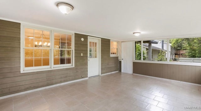 3033 Willow Lane Dr, Montgomery, AL 36109 - unfurnished room with a chandelier and wooden walls