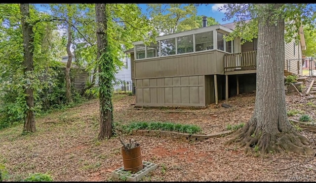 3033 Willow Lane Dr, Montgomery, AL 36109 - rear view of house with a sunroom and a deck