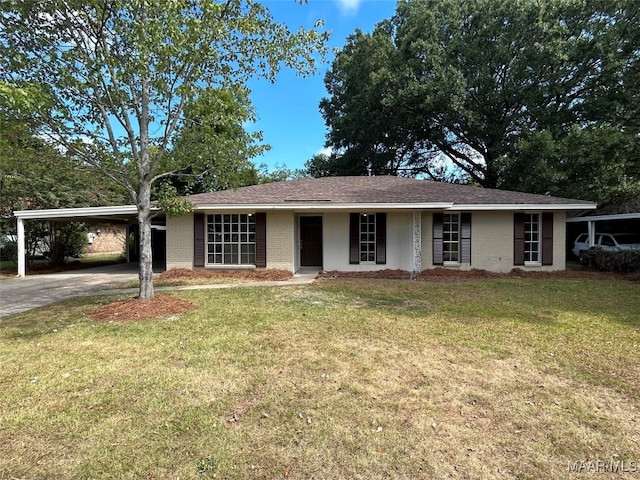 ranch-style house with a carport and a front lawn