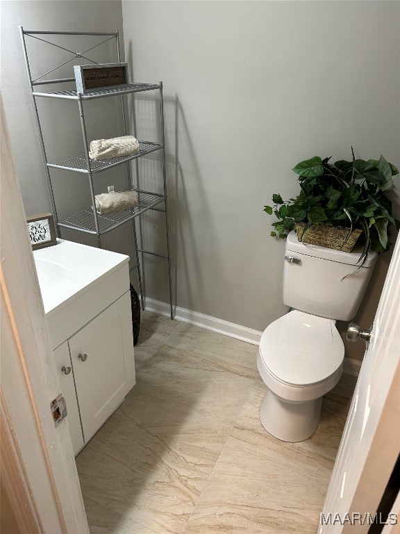 bathroom featuring vanity and toilet