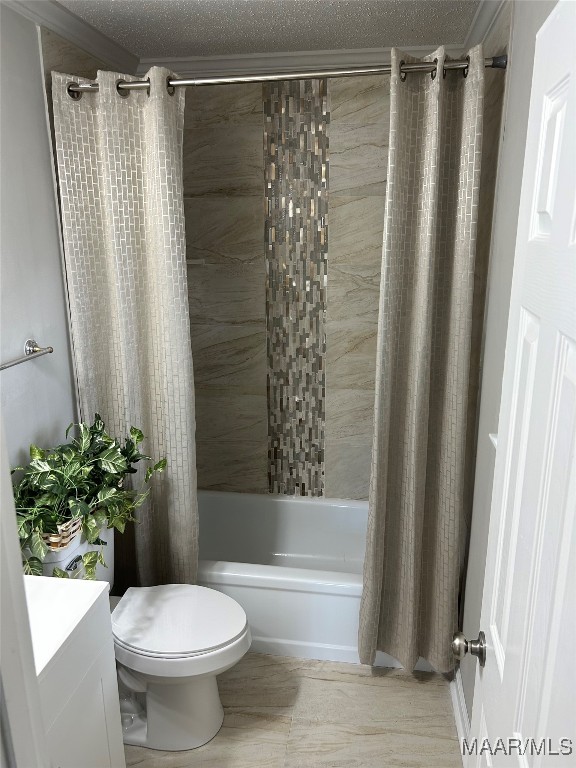 full bathroom featuring vanity, a textured ceiling, toilet, and shower / bath combo