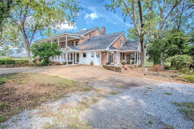 601 N Pickett St, Autaugaville, AL 36003 - view of front of house with french doors, driveway, and a chimney