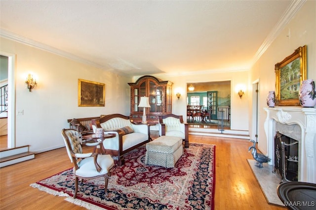 601 N Pickett St, Autaugaville, AL 36003 - living room with ornamental molding, baseboards, a premium fireplace, and wood finished floors