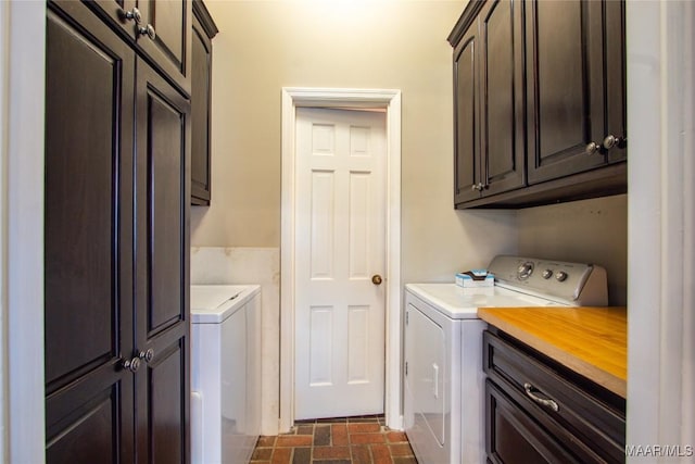 601 N Pickett St, Autaugaville, AL 36003 - washroom featuring cabinet space, washing machine and dryer, and brick floor
