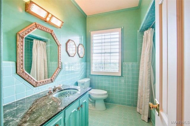 601 N Pickett St, Autaugaville, AL 36003 - bathroom with tile walls, a wainscoted wall, crown molding, toilet, and vanity