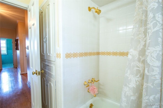 601 N Pickett St, Autaugaville, AL 36003 - bathroom with shower / bathtub combination with curtain and wood finished floors