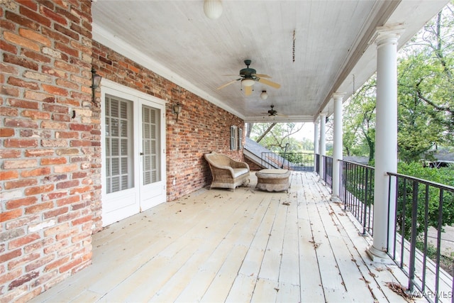 deck with ceiling fan and french doors