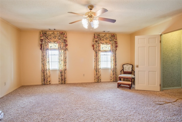 unfurnished room with carpet, ceiling fan, and plenty of natural light