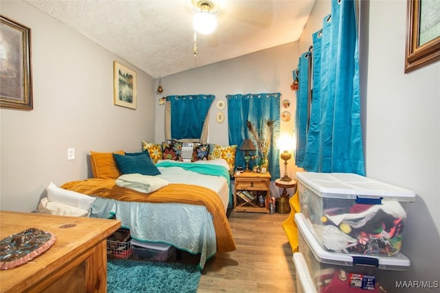 601 N Pickett St, Autaugaville, AL 36003 - bedroom featuring a textured ceiling, wood finished floors, and vaulted ceiling