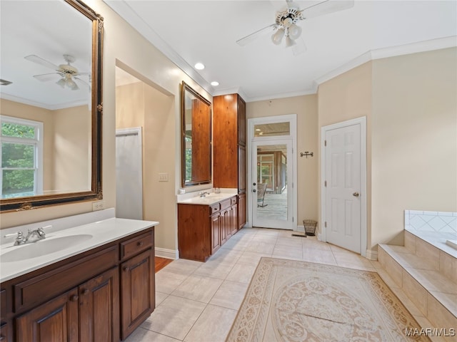 bathroom featuring ceiling fan, vanity, a tub to relax in, crown molding, and tile patterned flooring