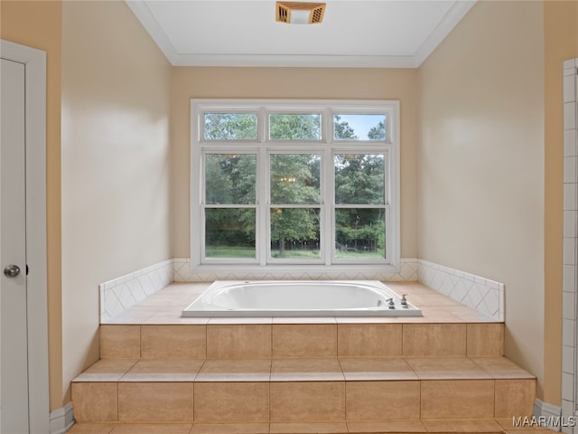 bathroom featuring tiled tub and crown molding