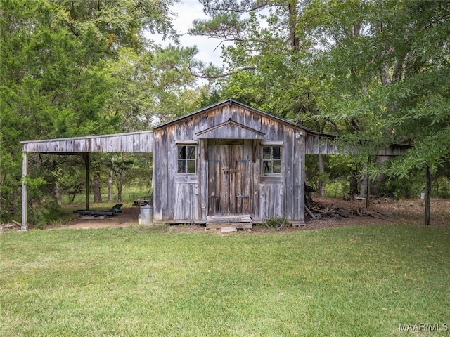 view of outdoor structure with a lawn