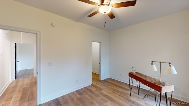 interior space featuring light wood-type flooring and ceiling fan