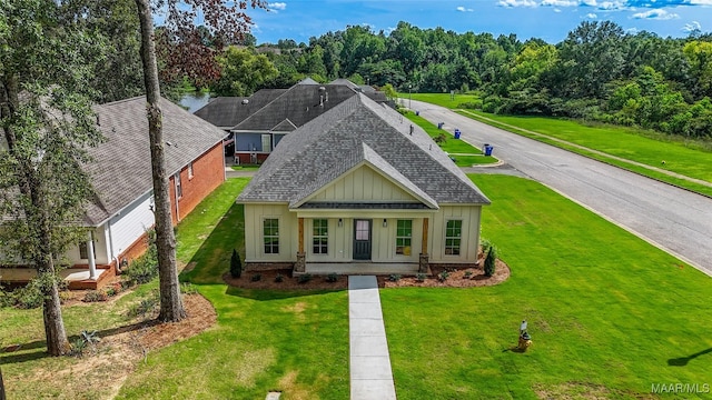 craftsman-style home with a front yard