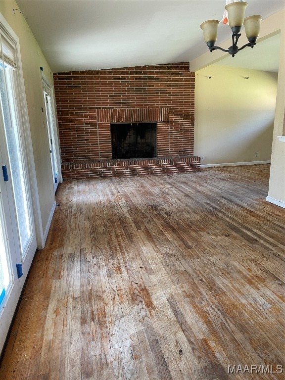 unfurnished living room featuring hardwood / wood-style floors and a fireplace