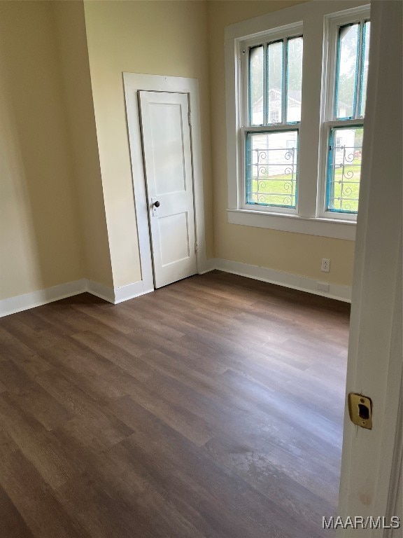 spare room featuring dark hardwood / wood-style floors