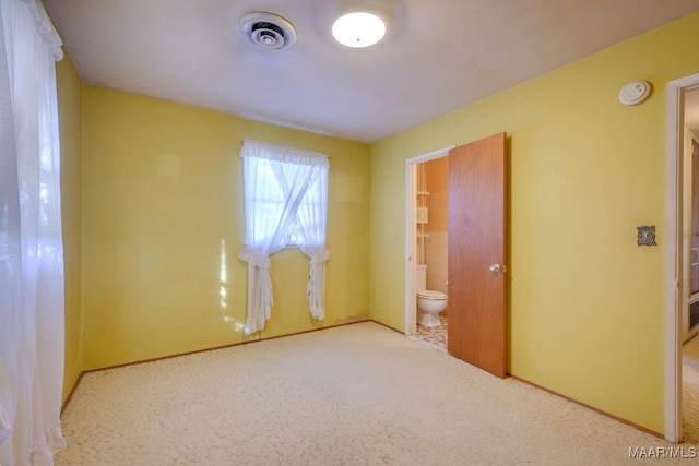 empty room featuring light carpet